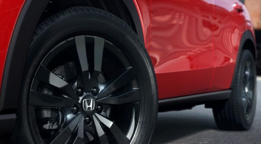 Wheels on a red 2027 Honda HR-V.