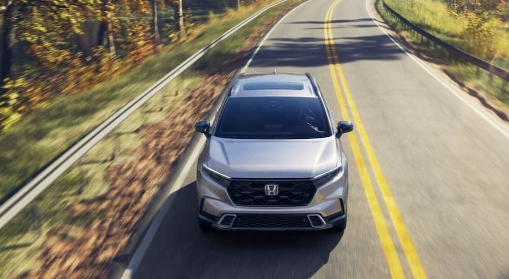 Silver 2026 Honda CR-V driving on a highway.
