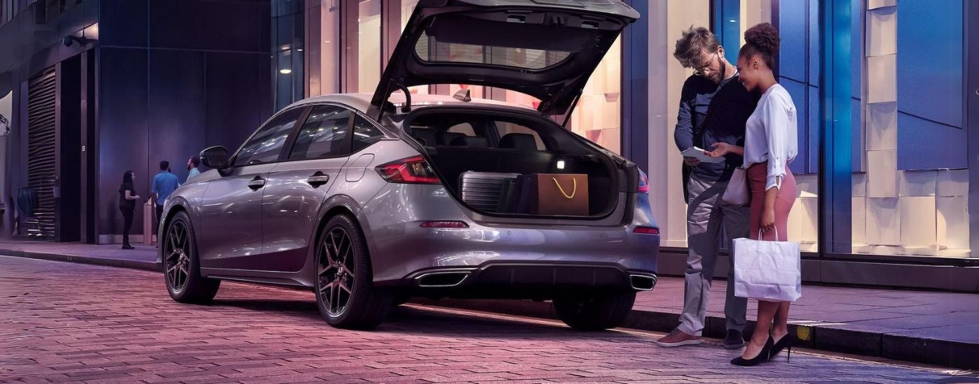 The trunk of a 2026 Honda Civic open and filled with items