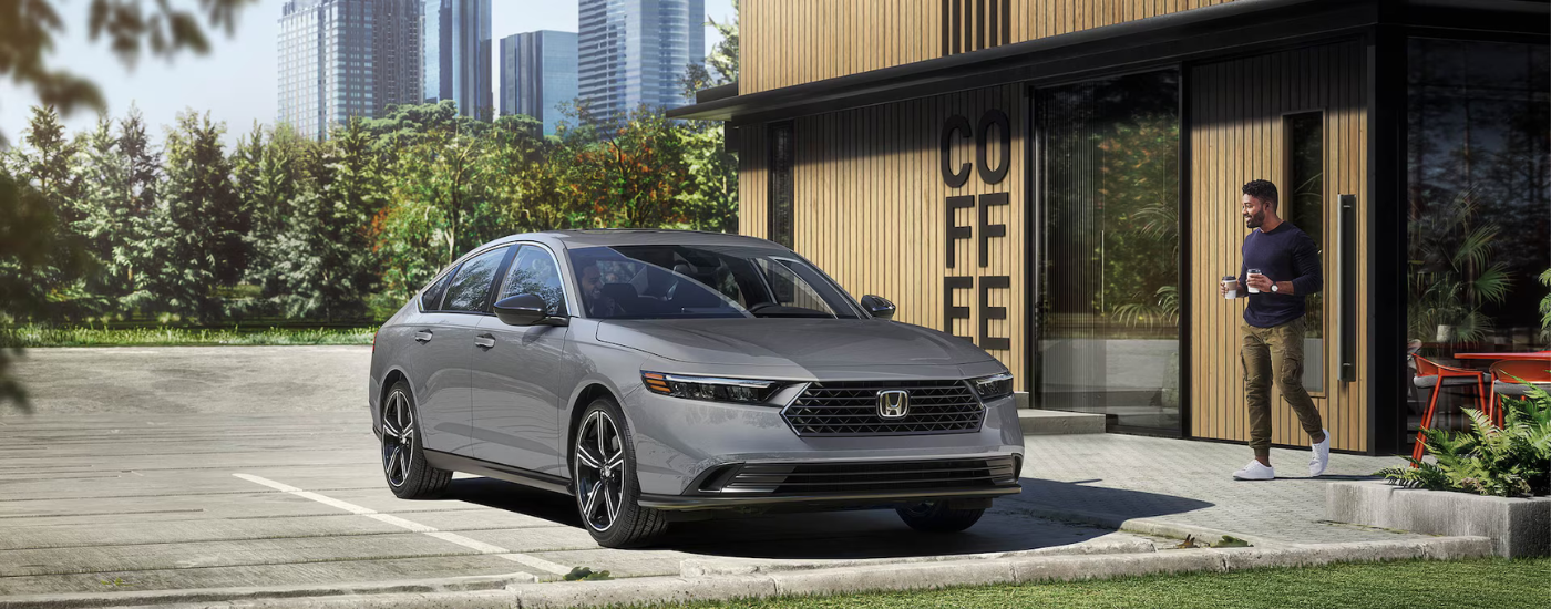 Silver 2025 Honda Accord parked outside a coffee shop