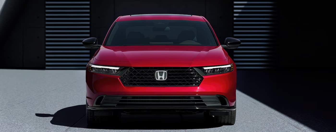 Front of a red 2026 Honda Accord Hybrid parked