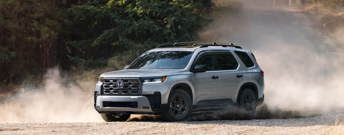 Grey 2026 Honda Pilot drifting off-road