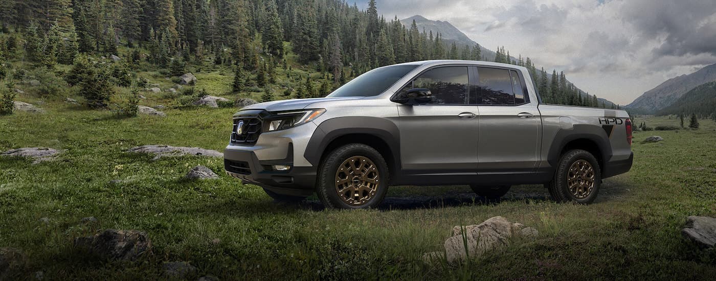 A silver 2021 Honda Ridgeline from the side after leaving a dealer that has a used Honda for sale near Dothan.